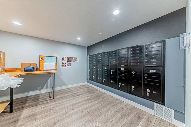 an empty room with furniture and wooden floor