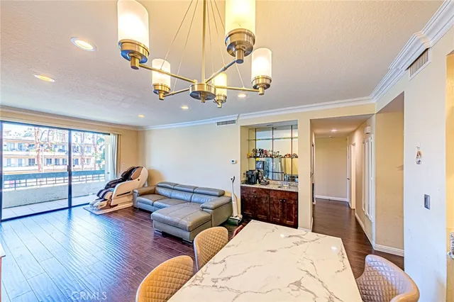 a bedroom with furniture and wooden floor