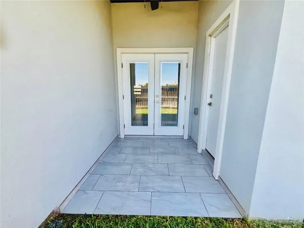 a view of a balcony with floor to ceiling window and floor