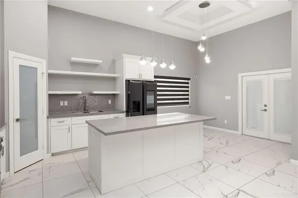a kitchen with cabinets and white appliances