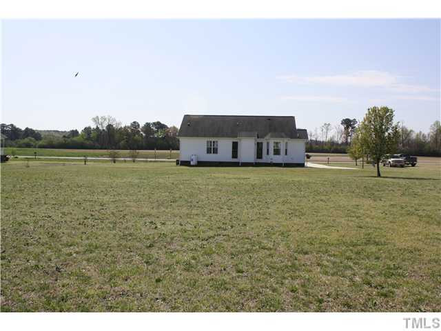 4695 Rains Crossroads Road Princeton, NC 27569 - Photo 4 of 17 EXTERIOR BACK VIEW OF HOME WITH LARGE BACK YARD. UNDERGROUND DOG FENCE