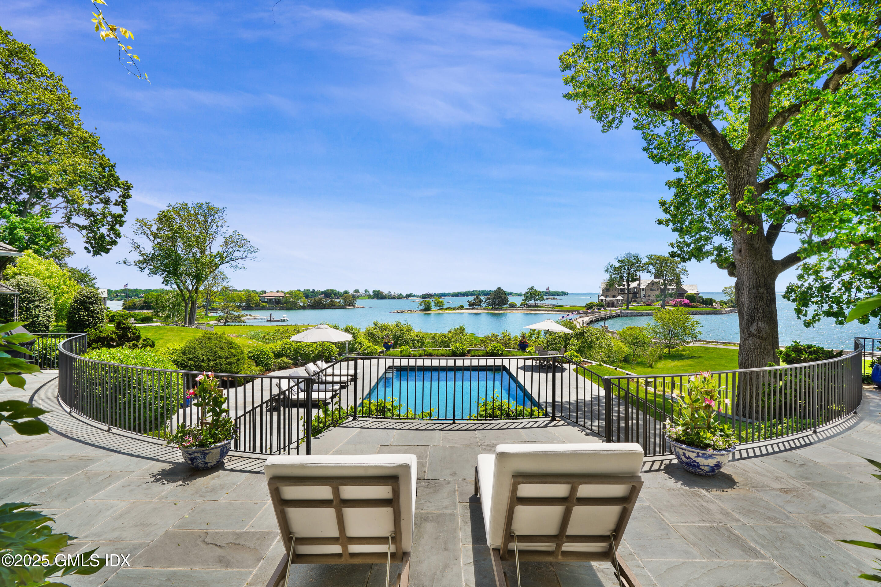 579 Indian Field Road Greenwich, CT 06830 - Photo 4 of 7 a view of a chairs and table on the terrace