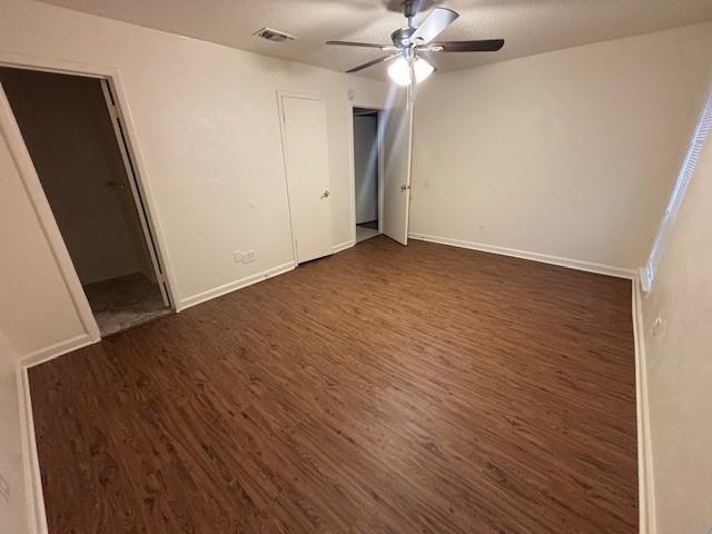 762 East Pecan Street Hurst, TX 76053 - Photo 13 of 16 an empty room with wooden floor and fan