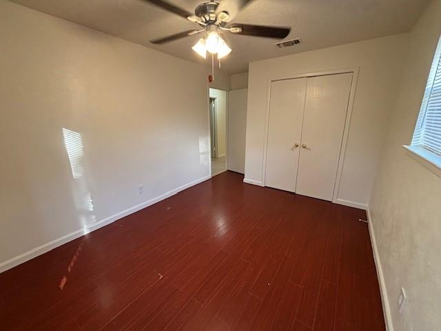 760 East Pecan Street Hurst, TX 76053 - Photo 14 of 16 an empty room with a ceiling fan and a window