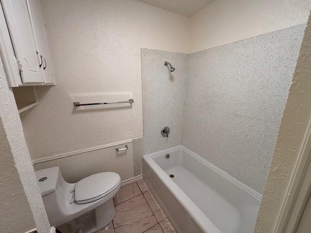 760 East Pecan Street Hurst, TX 76053 - Photo 15 of 16 a white toilet sitting next to a bath tub