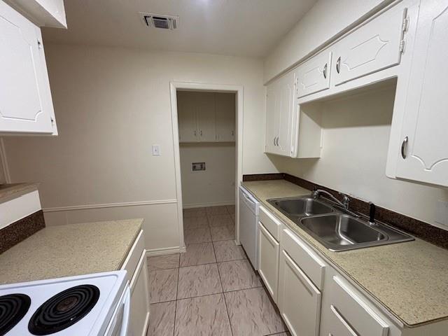 760 East Pecan Street Hurst, TX 76053 - Photo 5 of 16 a kitchen that has a sink and a stove