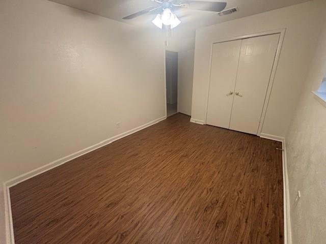 762 East Pecan Street Hurst, TX 76053 - Photo 9 of 16 a view of an empty room with wooden floor and a ceiling fan