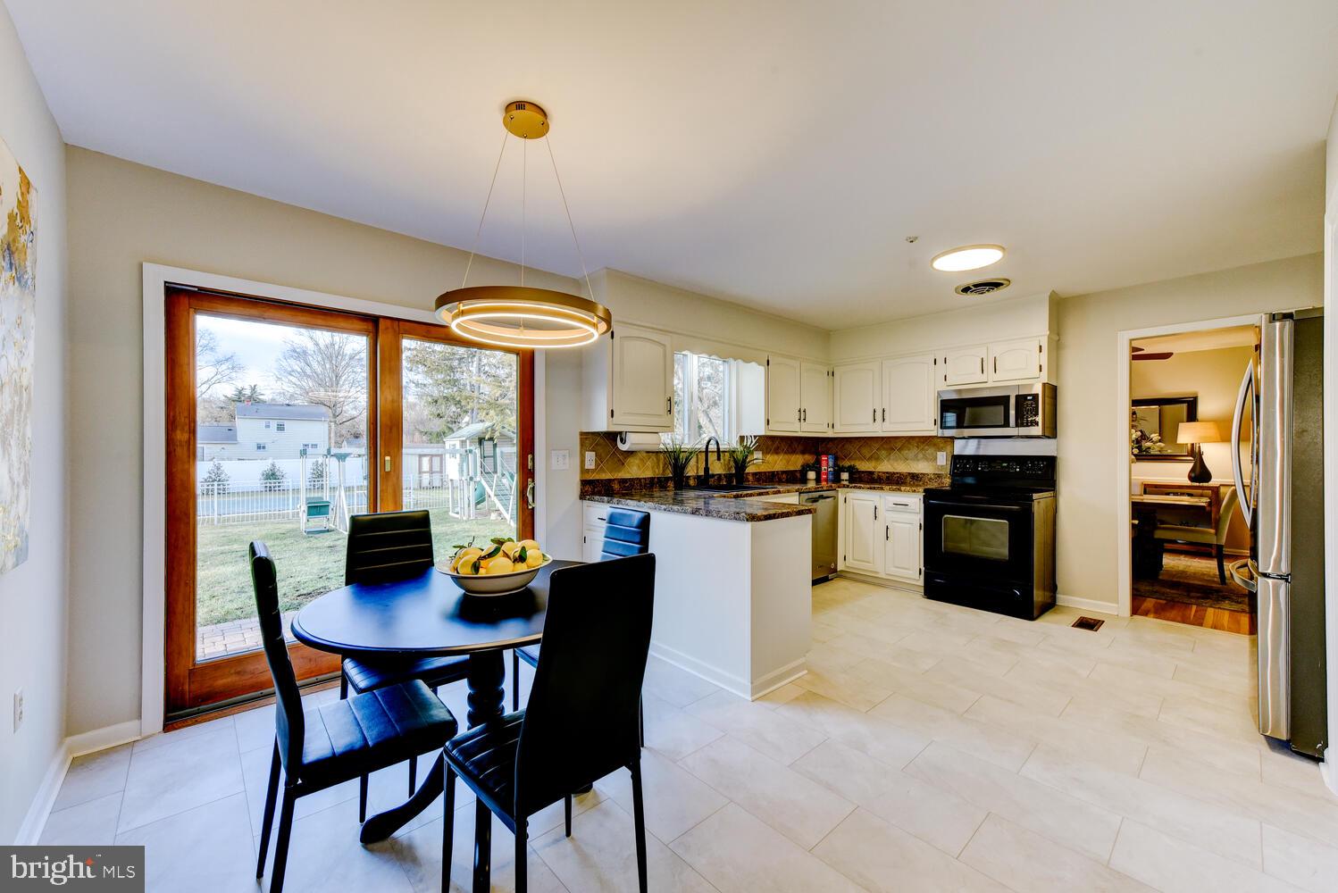 6 Coventry Circle Princeton Junction, NJ 08550 - Photo 14 of 70 a kitchen with a table and chairs in it