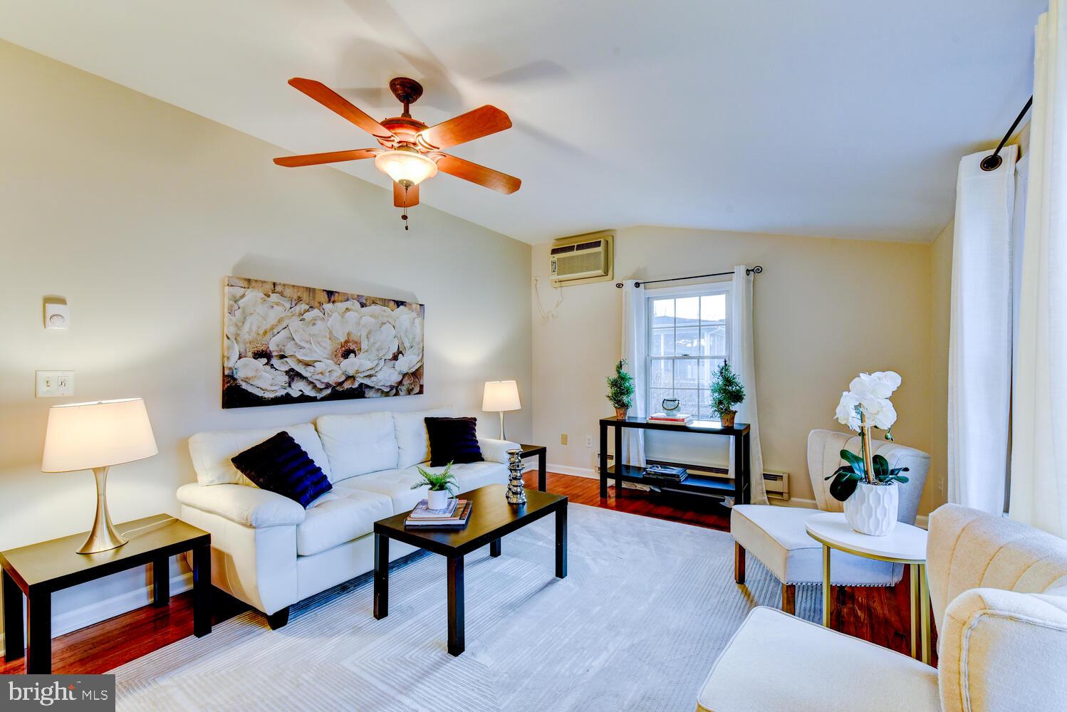 6 Coventry Circle Princeton Junction, NJ 08550 - Photo 25 of 70 a living room with furniture a window and a chandelier