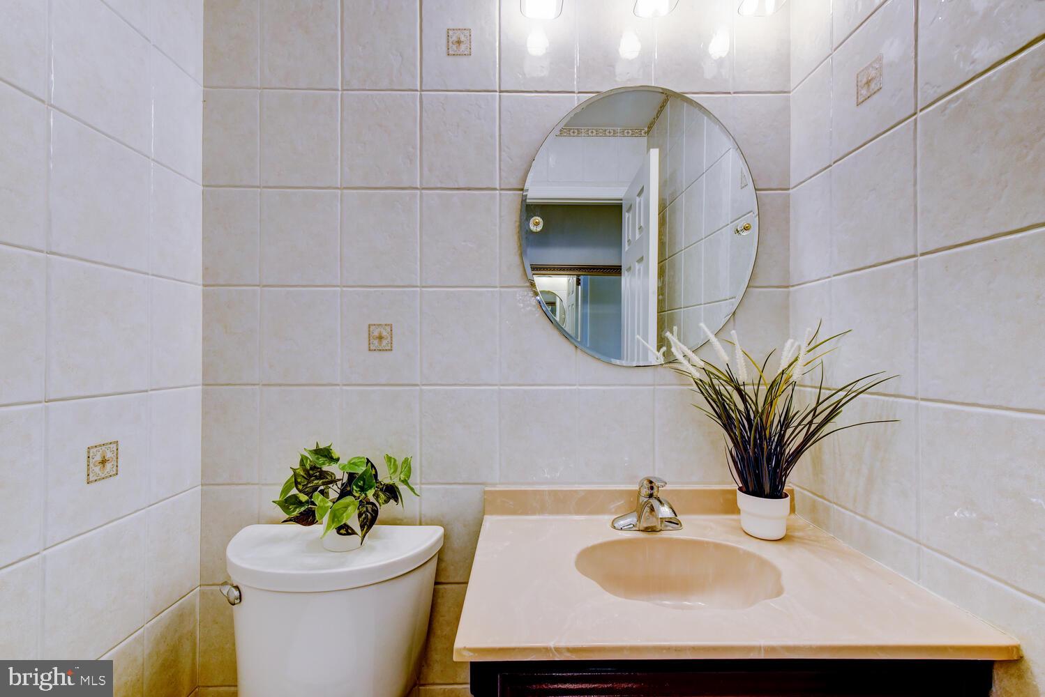 6 Coventry Circle Princeton Junction, NJ 08550 - Photo 28 of 70 a bathroom with a sink a toilet and a mirror