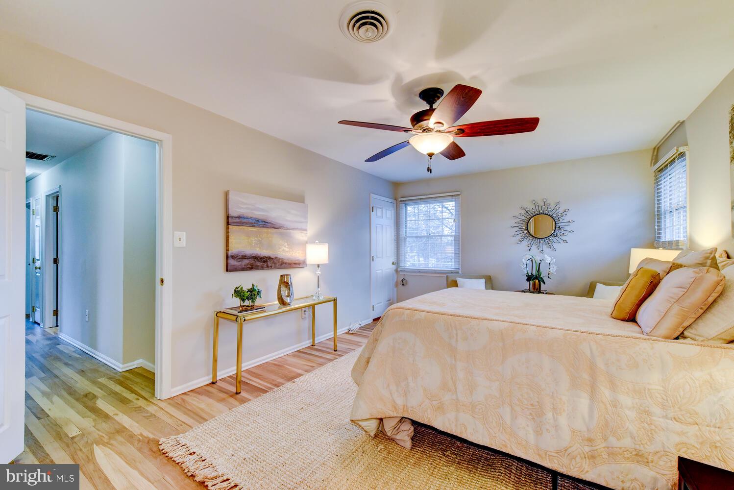 6 Coventry Circle Princeton Junction, NJ 08550 - Photo 31 of 70 a bedroom with a bed and a chandelier