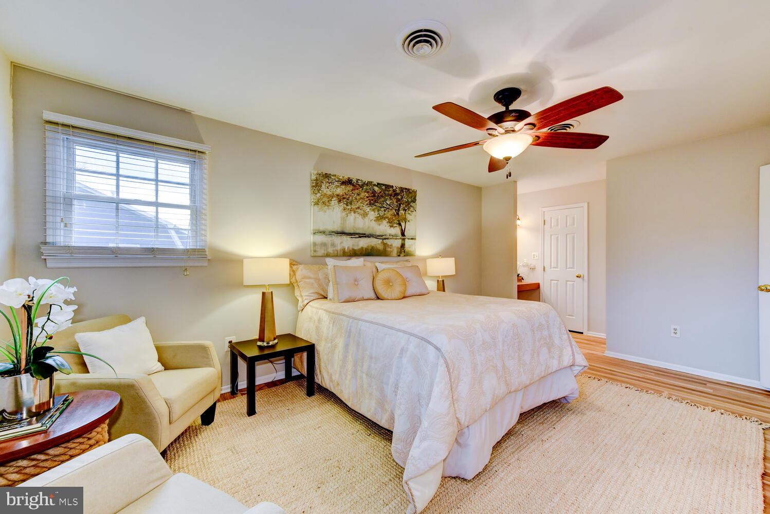 6 Coventry Circle Princeton Junction, NJ 08550 - Photo 32 of 70 a bedroom with a bed and a chandelier