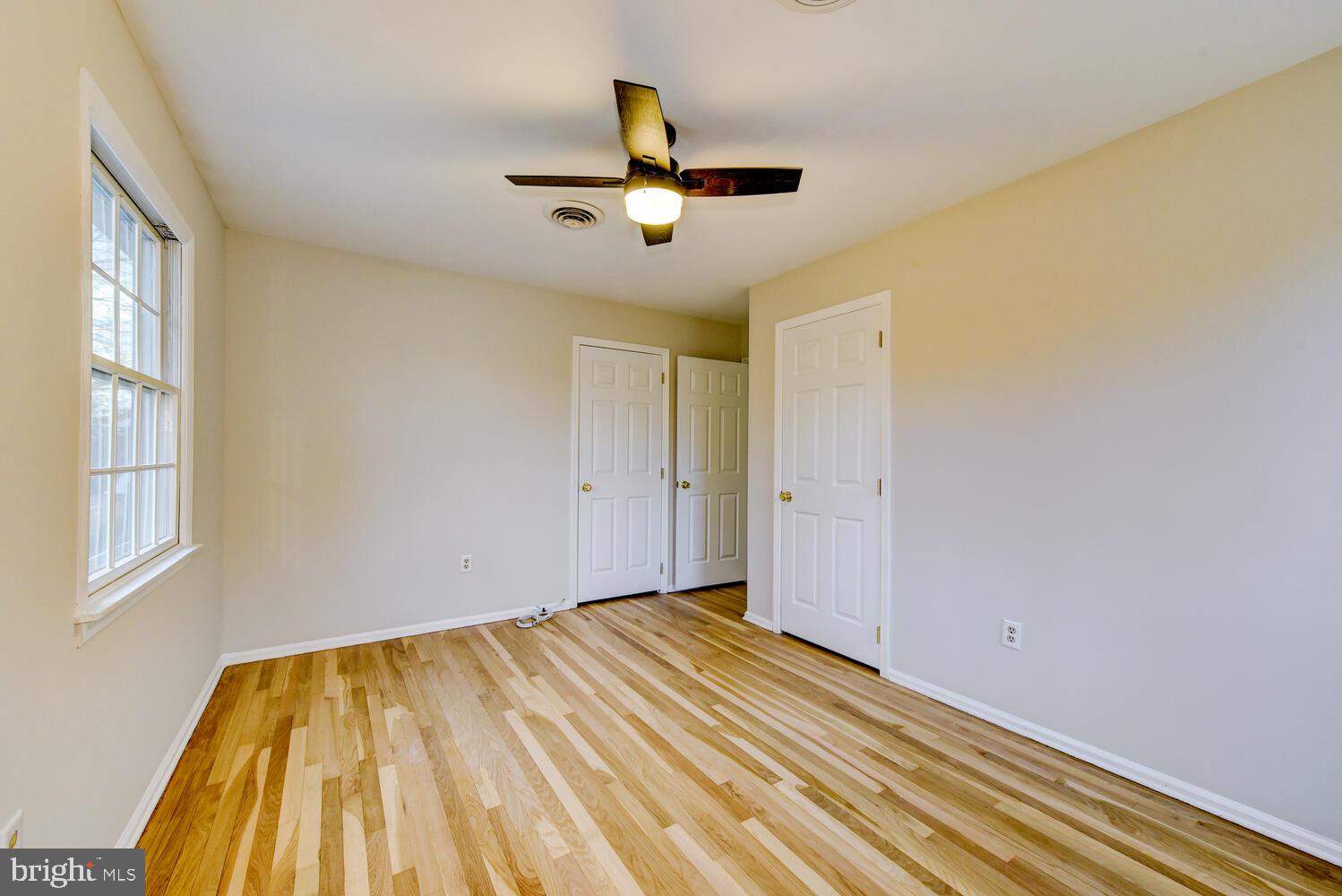 6 Coventry Circle Princeton Junction, NJ 08550 - Photo 44 of 70 a view of a room with wooden floor ceiling fan and window