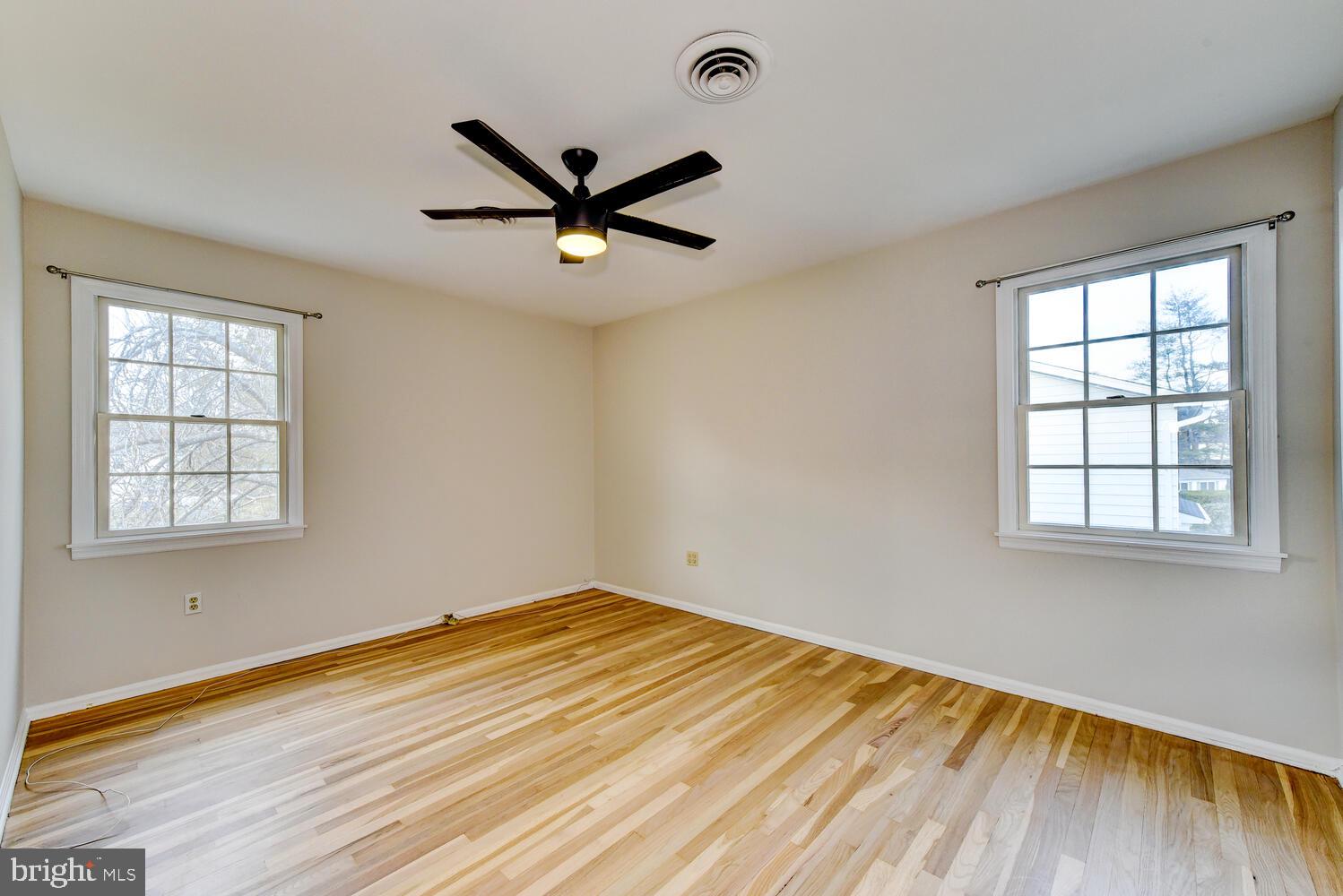 6 Coventry Circle Princeton Junction, NJ 08550 - Photo 45 of 70 a view of a big room with wooden floor and windows