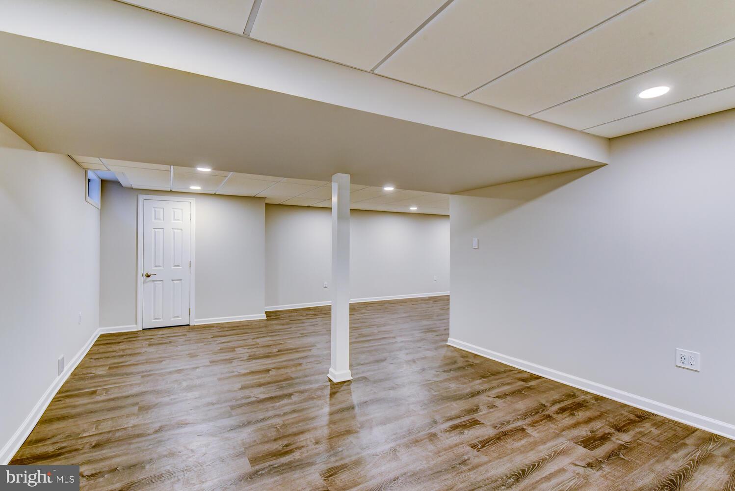 6 Coventry Circle Princeton Junction, NJ 08550 - Photo 50 of 70 a view of an empty room with wooden floor