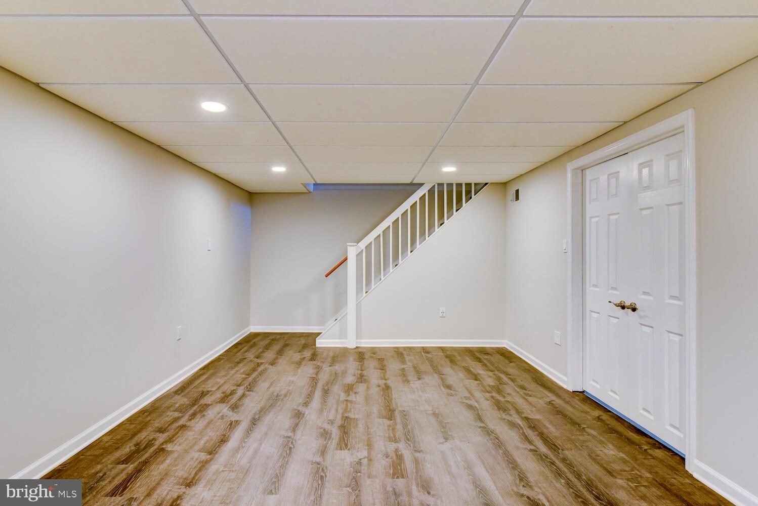 6 Coventry Circle Princeton Junction, NJ 08550 - Photo 51 of 70 a view of room with stairs and wooden floor