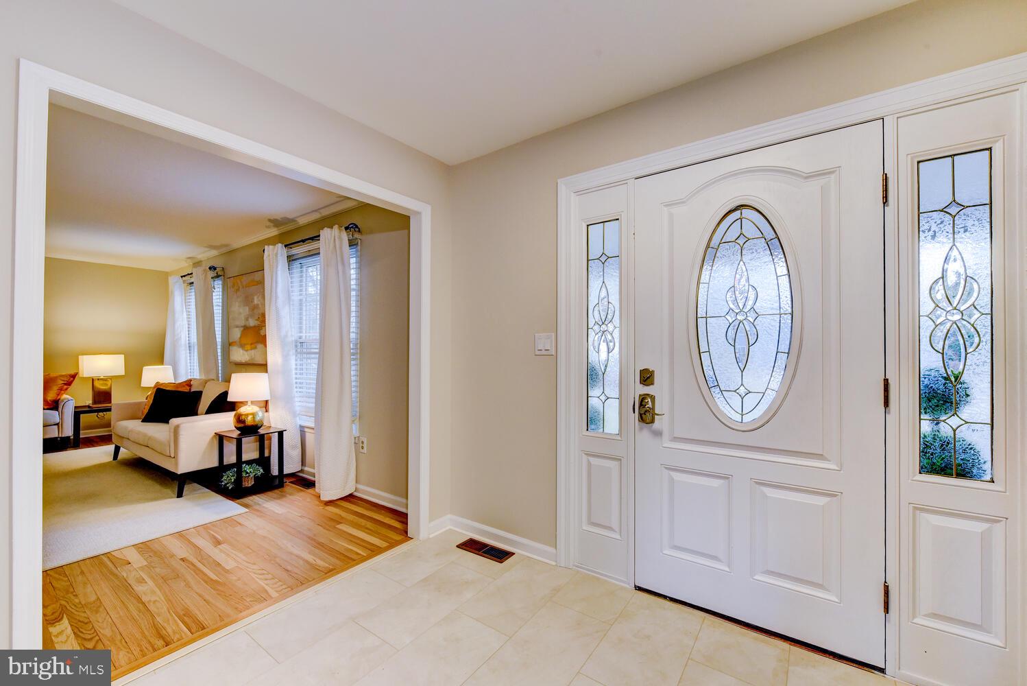 6 Coventry Circle Princeton Junction, NJ 08550 - Photo 6 of 70 a living room with furniture and a large mirror