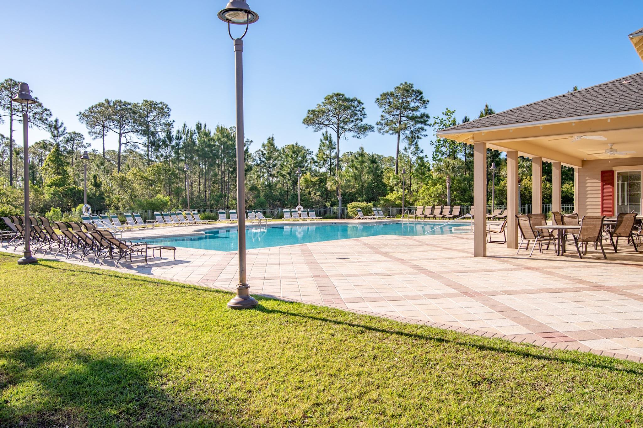 134 Pin Oak Loop Santa Rosa Beach, FL 32459 - Photo 36 of 51 a view of a swimming pool with a yard