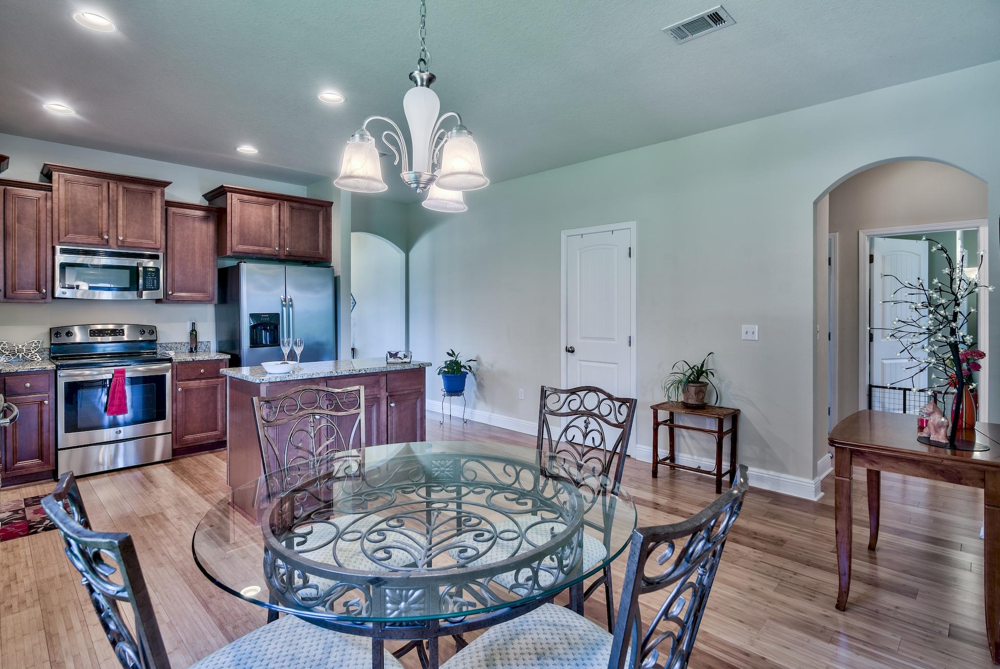 134 Pin Oak Loop Santa Rosa Beach, FL 32459 - Photo 8 of 51 a view of a dining room with furniture