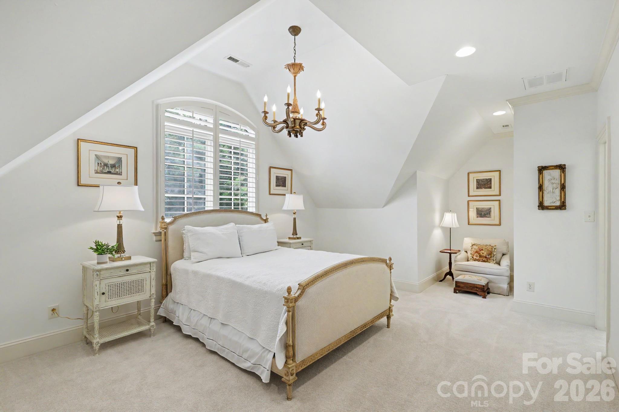 508 Hideaway Ridge Court Matthews, NC 28105 - Photo 31 of 47 a bedroom with a bed chandelier and a window