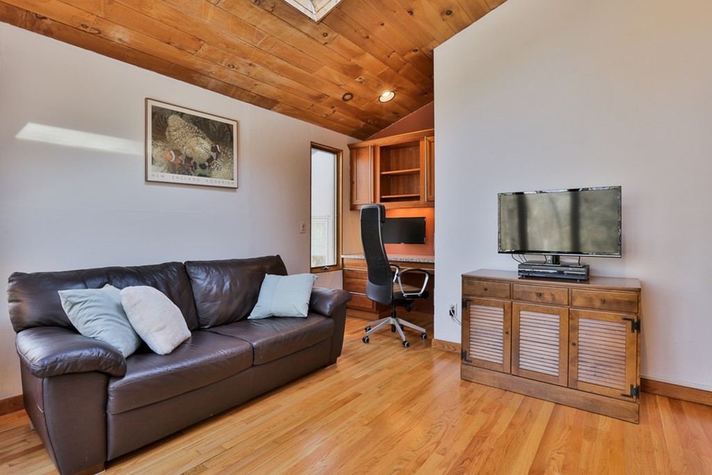 119 Pinnacle Road Harvard, MA 01451 - Photo 11 of 30 a living room with furniture and a flat screen tv
