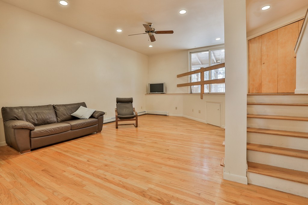 119 Pinnacle Road Harvard, MA 01451 - Photo 22 of 30 a living room with furniture and a wooden floor