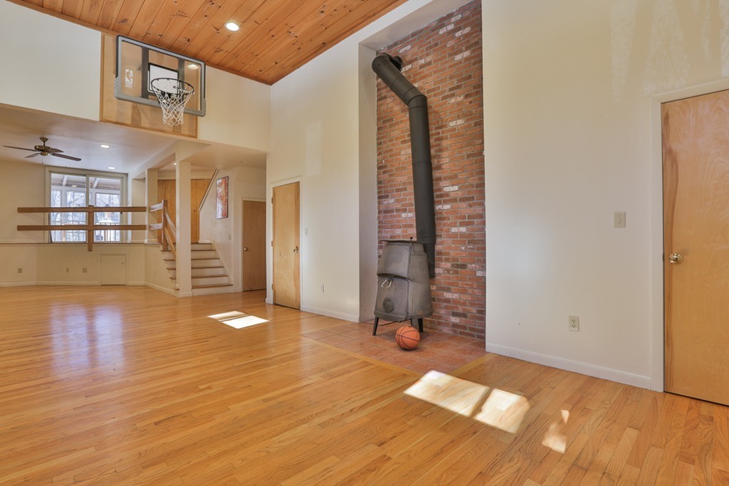 119 Pinnacle Road Harvard, MA 01451 - Photo 25 of 30 a view of an empty room with window and wooden floor