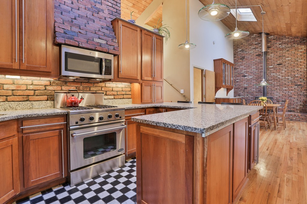 119 Pinnacle Road Harvard, MA 01451 - Photo 5 of 30 a kitchen with stainless steel appliances granite countertop a stove a sink and a microwave