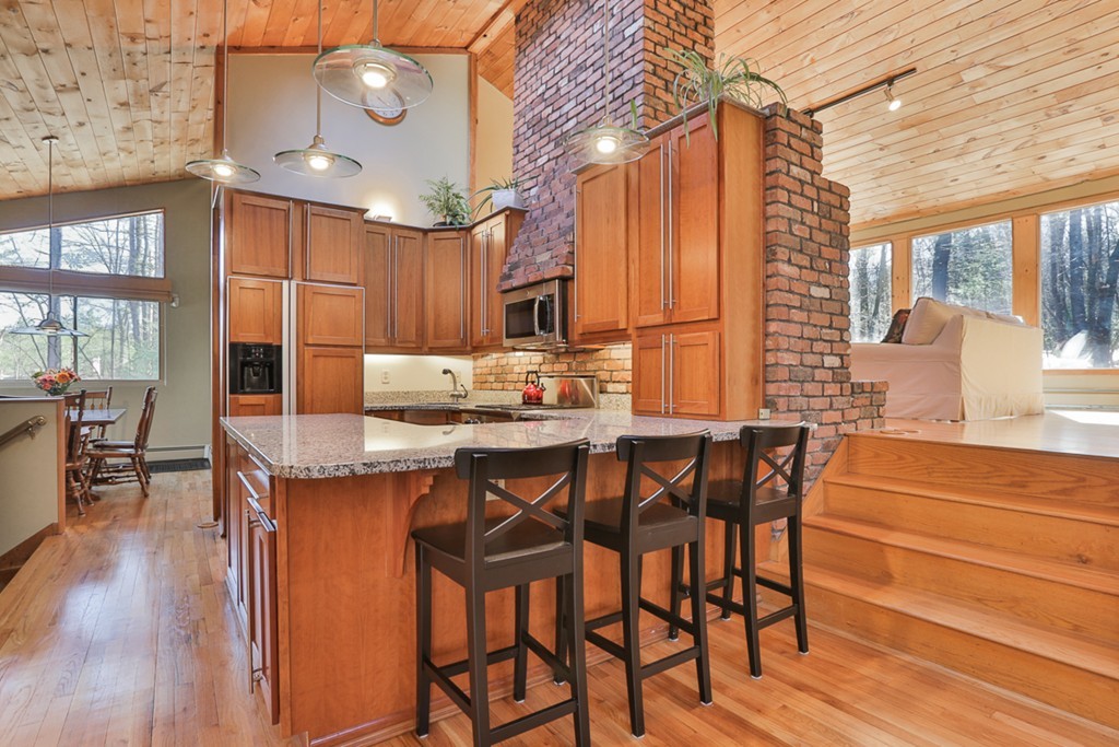119 Pinnacle Road Harvard, MA 01451 - Photo 6 of 30 a dining hall with stainless steel appliances kitchen island granite countertop wooden floor a dining table and chairs