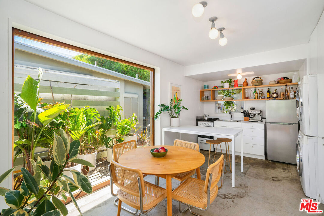 1819 Euclid Street Santa Monica, CA 90404 - Photo 19 of 55 a room with furniture and a potted plant