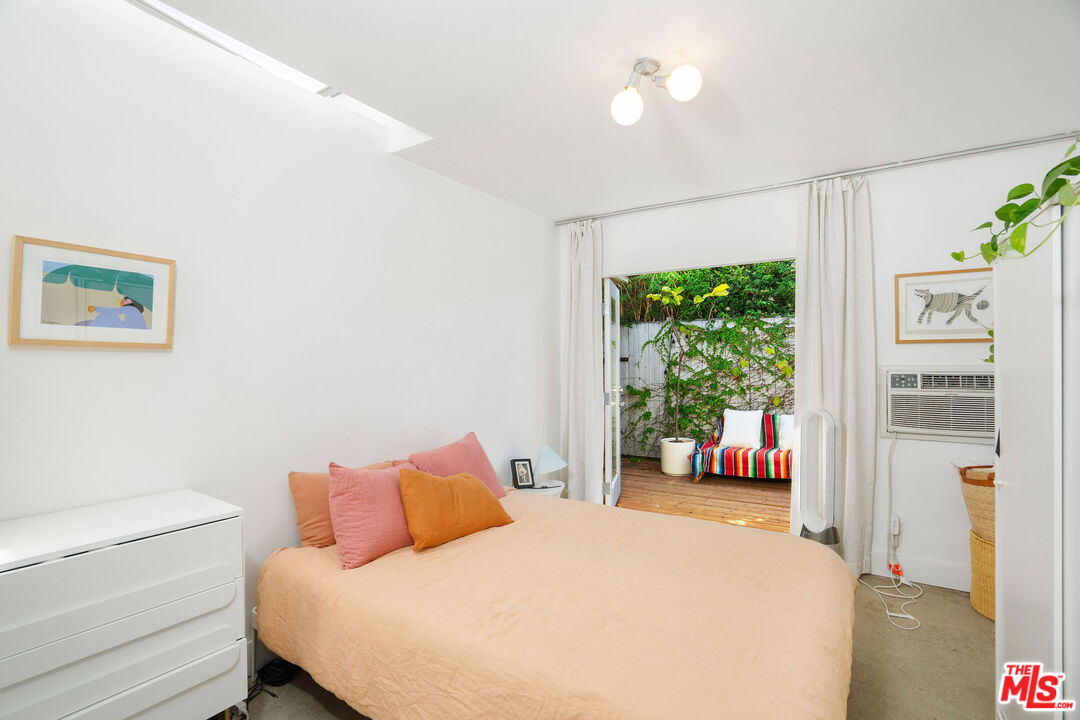 1819 Euclid Street Santa Monica, CA 90404 - Photo 22 of 55 a bedroom with a large bed and a large window