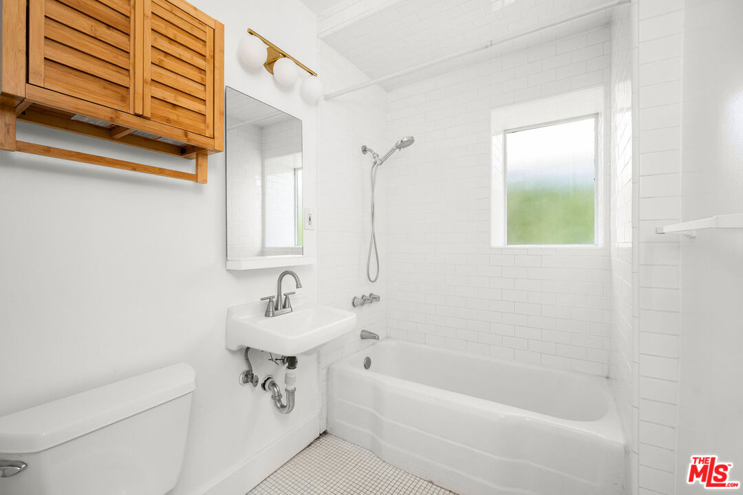 1819 Euclid Street Santa Monica, CA 90404 - Photo 33 of 55 a bathroom with a sink a toilet and shower