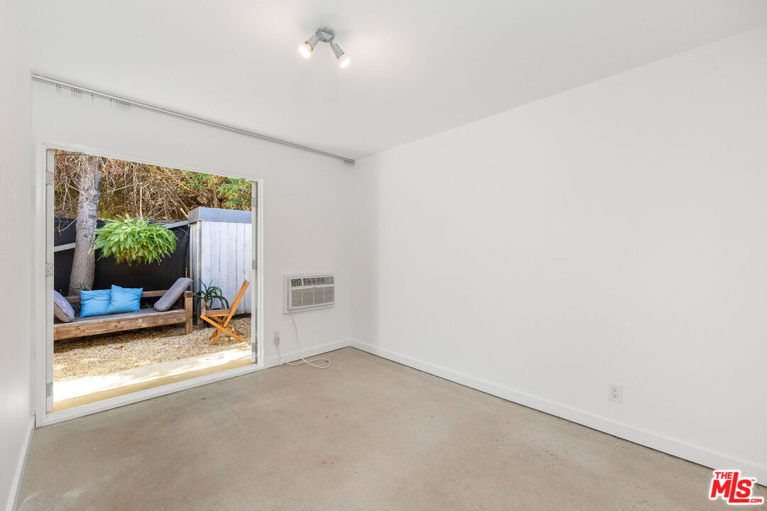 1819 Euclid Street Santa Monica, CA 90404 - Photo 44 of 55 an empty room with furniture and a window