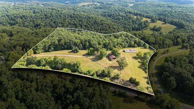 a view of a swimming pool with a yard