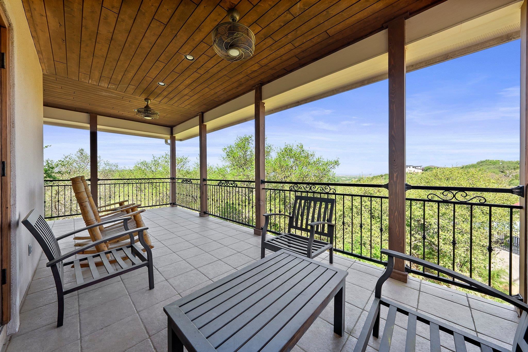 304 Hi Ridge Road Horseshoe Bay, TX 78657 - Photo 12 of 30 a balcony with wooden floor next to a yard