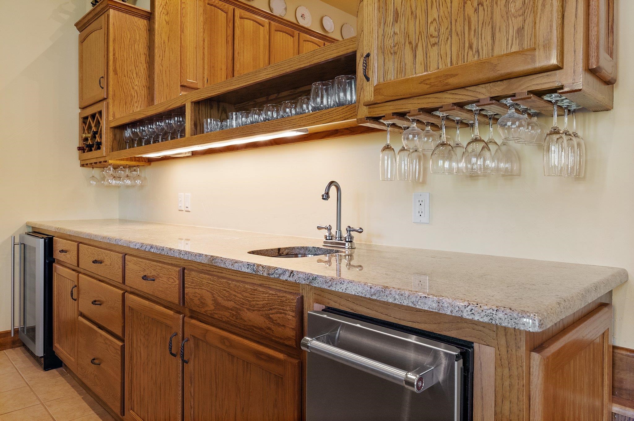 304 Hi Ridge Road Horseshoe Bay, TX 78657 - Photo 19 of 30 a kitchen with stainless steel appliances granite countertop a sink and cabinets