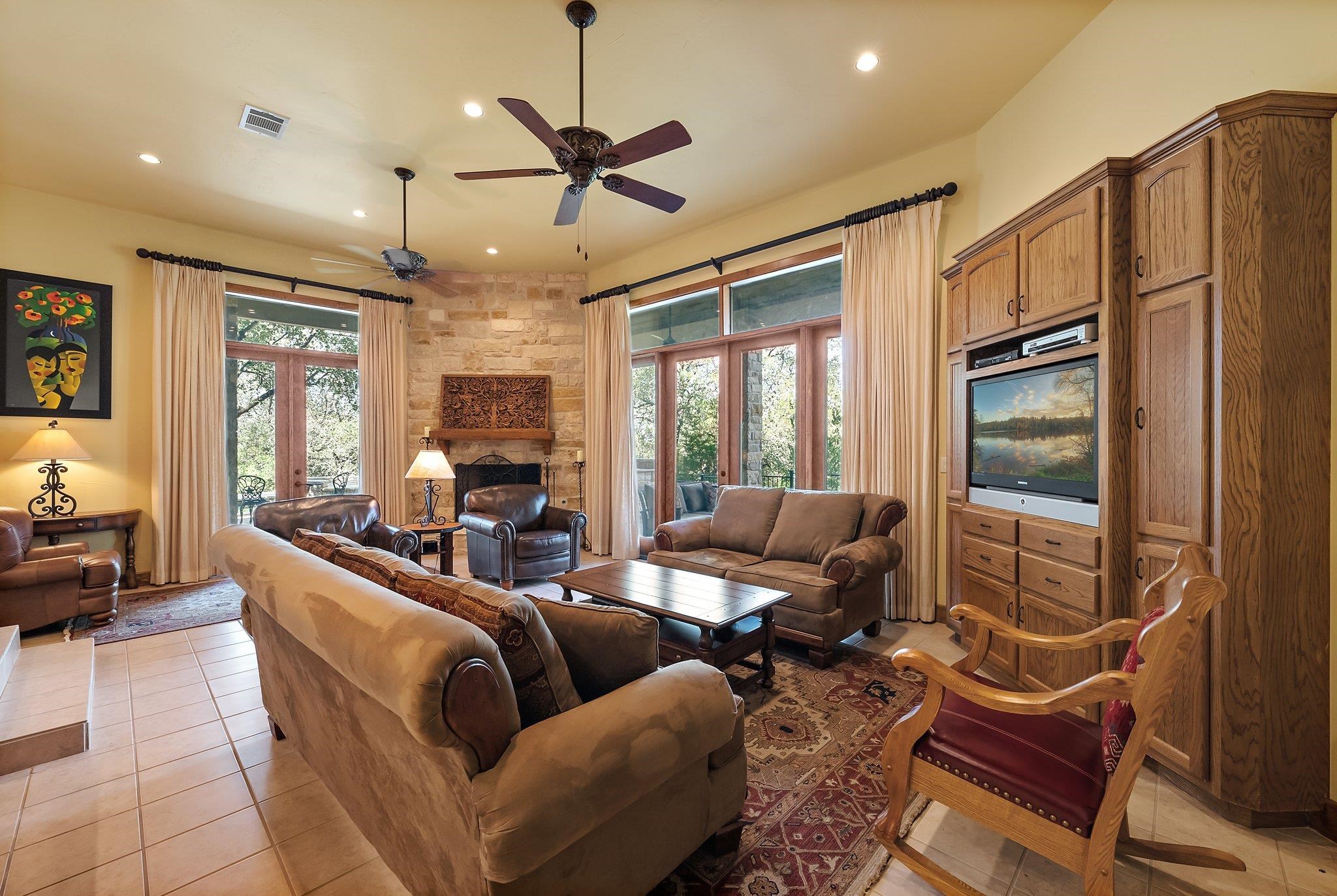 304 Hi Ridge Road Horseshoe Bay, TX 78657 - Photo 23 of 30 a living room with furniture ceiling fan and a window
