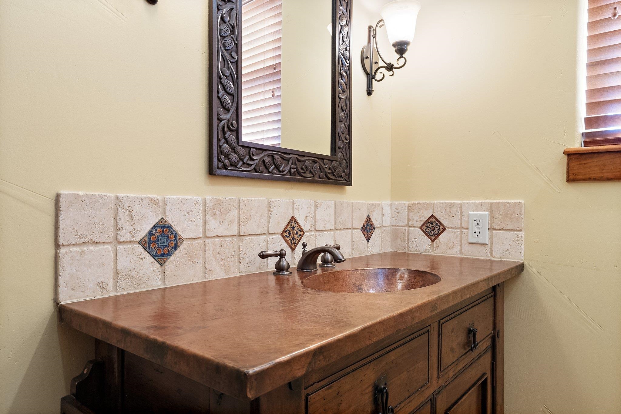 304 Hi Ridge Road Horseshoe Bay, TX 78657 - Photo 24 of 30 a bathroom with a sink and a mirror