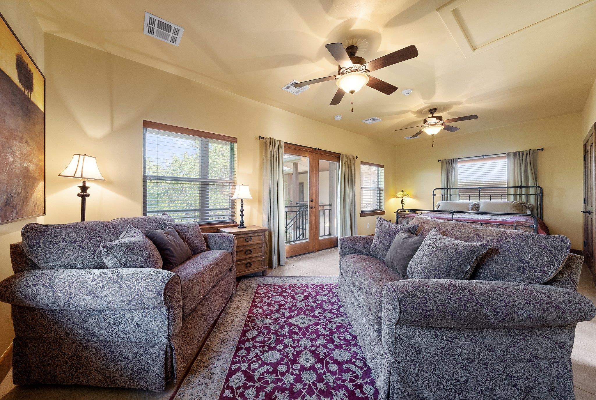 304 Hi Ridge Road Horseshoe Bay, TX 78657 - Photo 26 of 30 a living room with furniture a ceiling fan and a rug