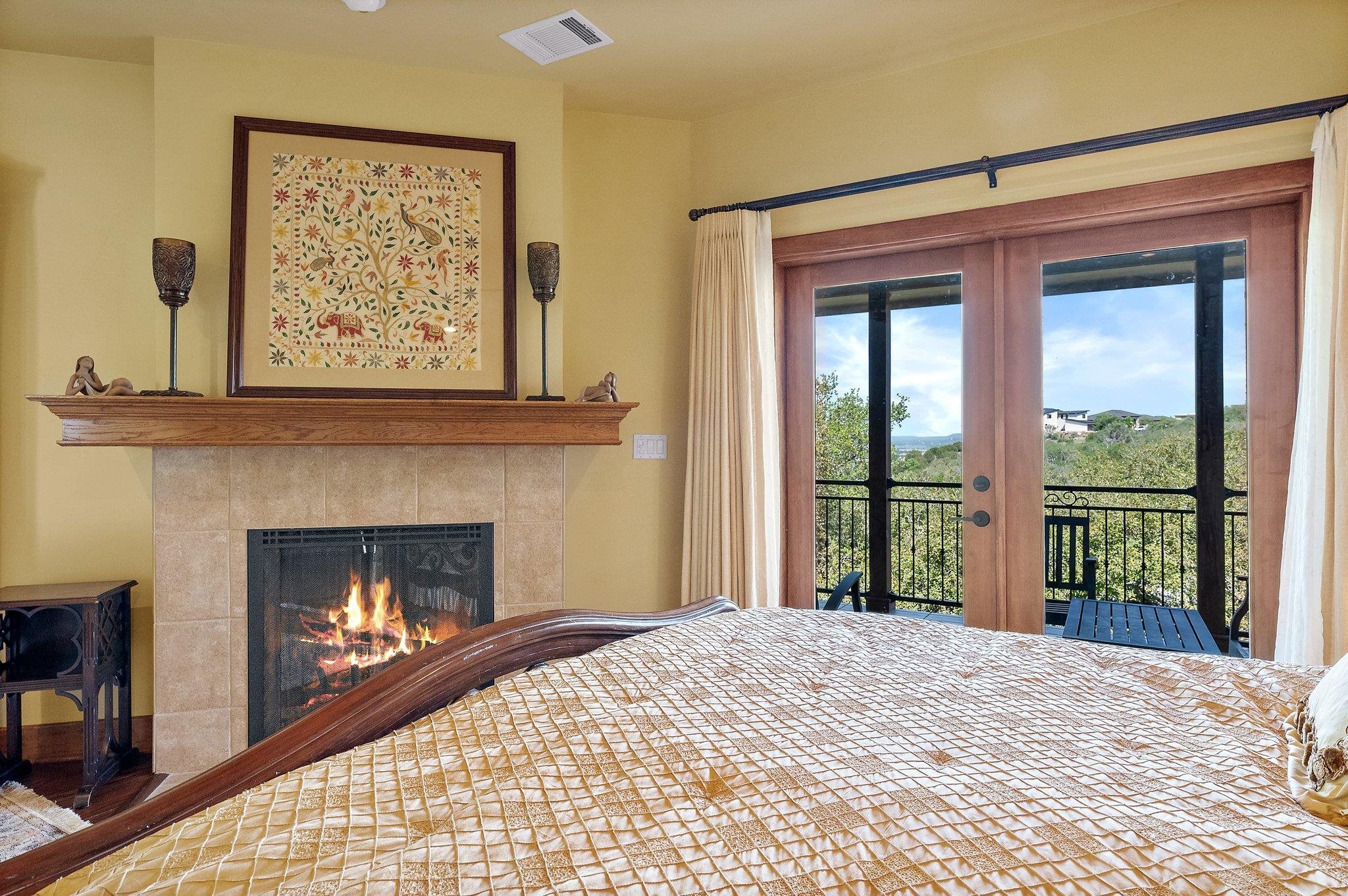 304 Hi Ridge Road Horseshoe Bay, TX 78657 - Photo 28 of 30 a bedroom with a bed and a fireplace