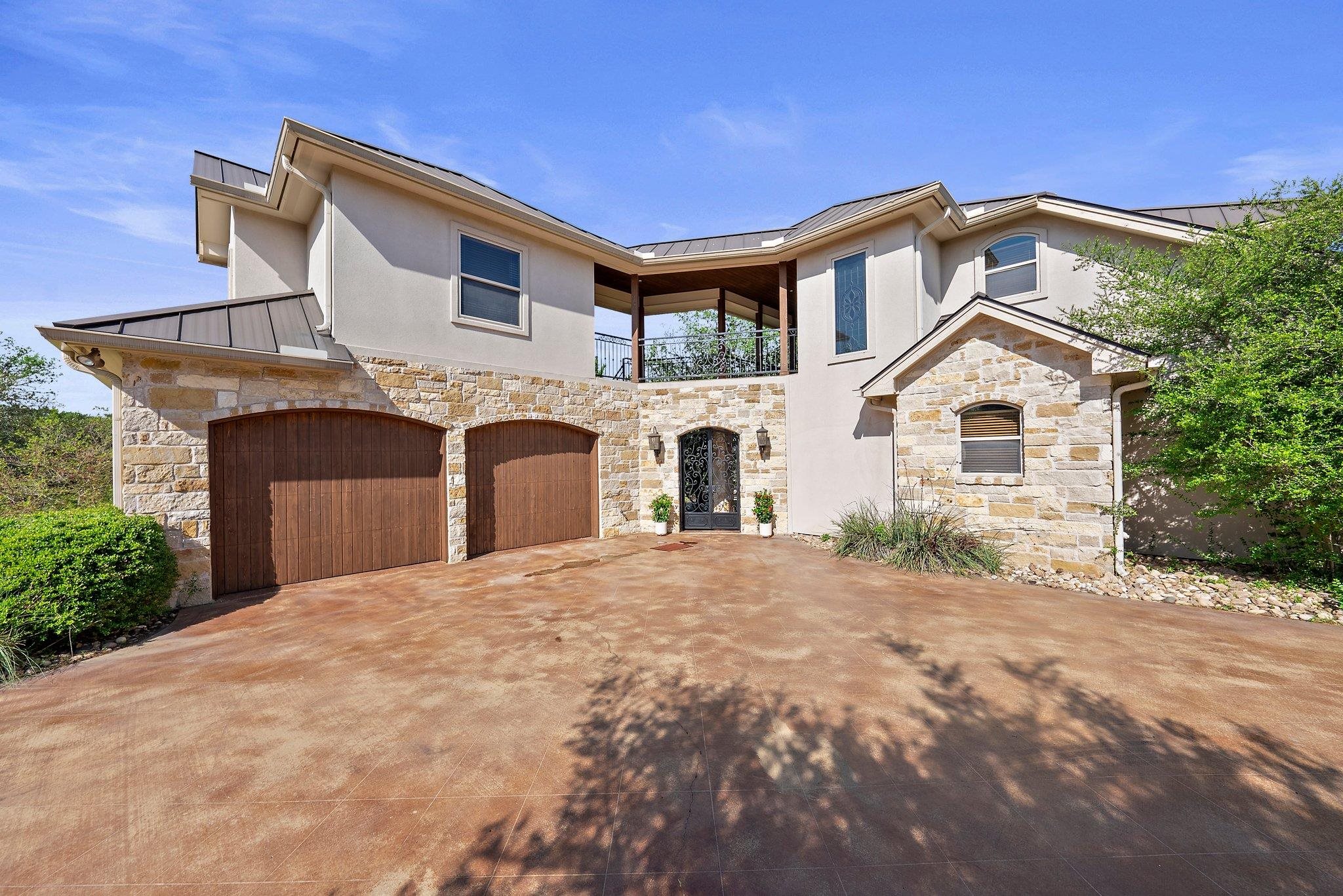 304 Hi Ridge Road Horseshoe Bay, TX 78657 - Photo 4 of 30 a front view of a house with a yard