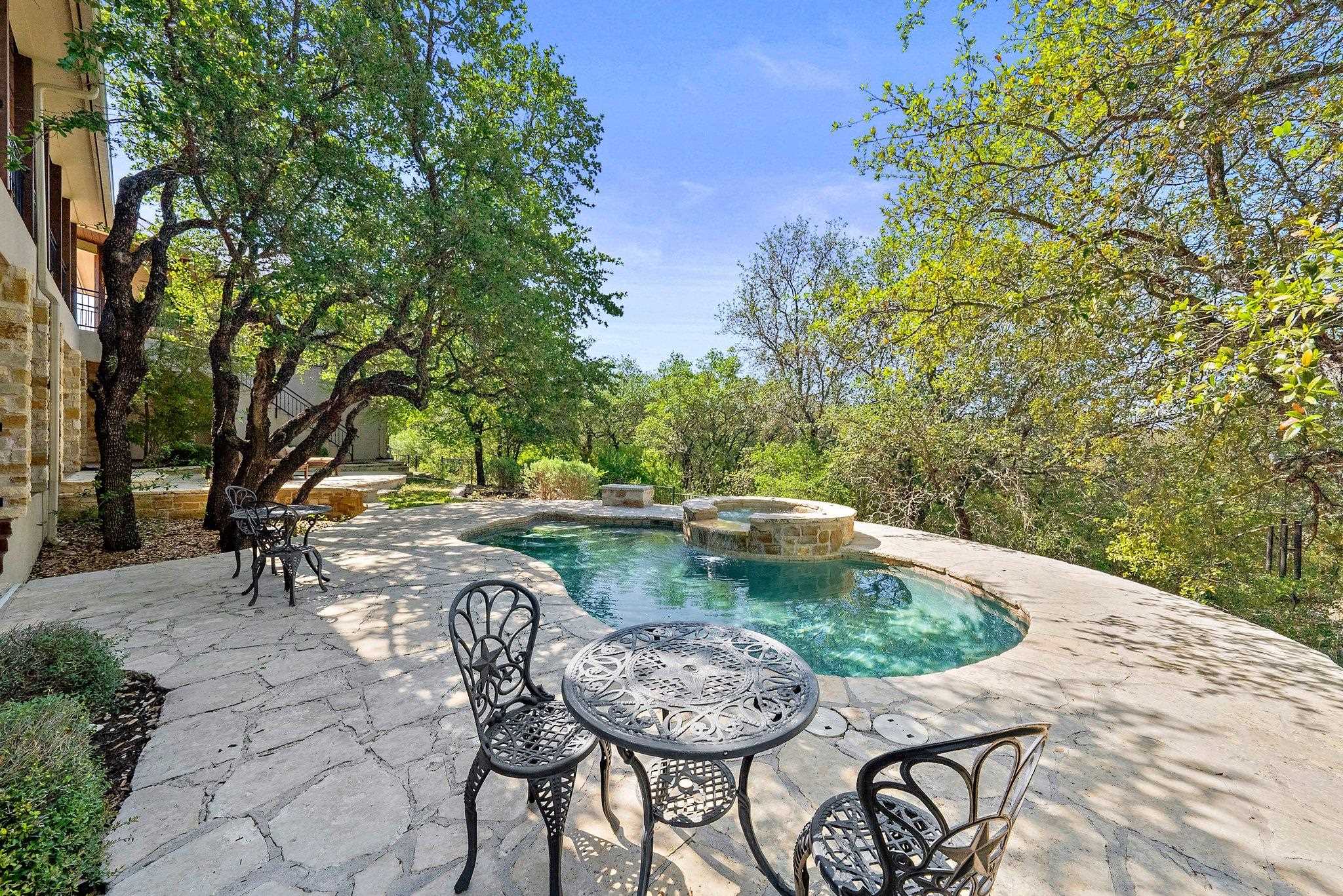 304 Hi Ridge Road Horseshoe Bay, TX 78657 - Photo 7 of 30 a view of a swimming pool with a patio