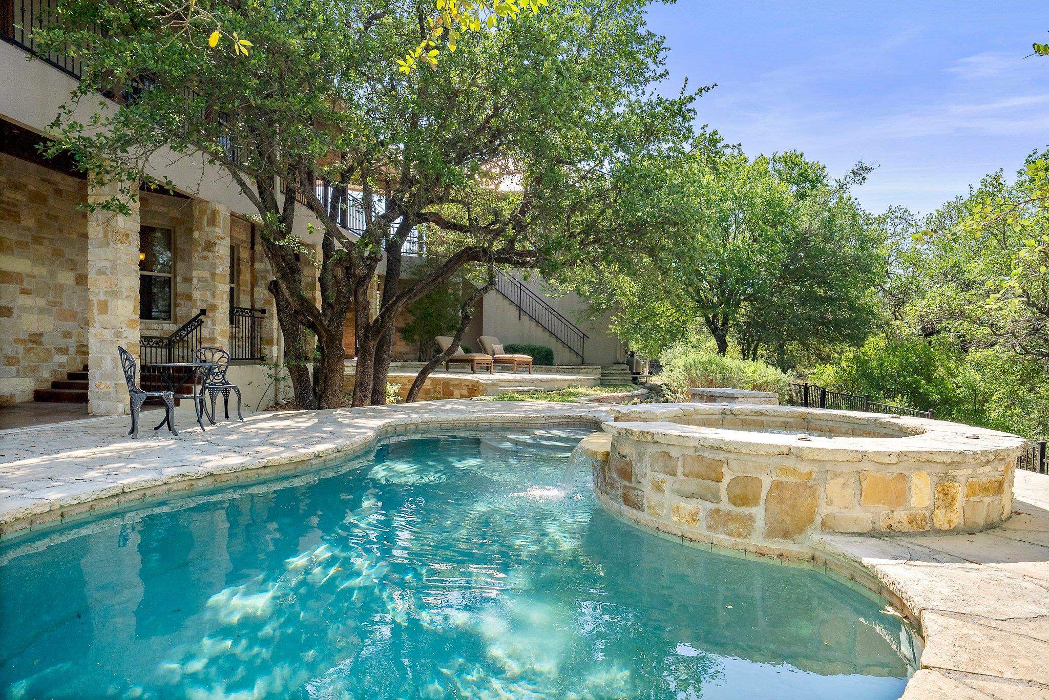 304 Hi Ridge Road Horseshoe Bay, TX 78657 - Photo 8 of 30 a view of a swimming pool with a patio