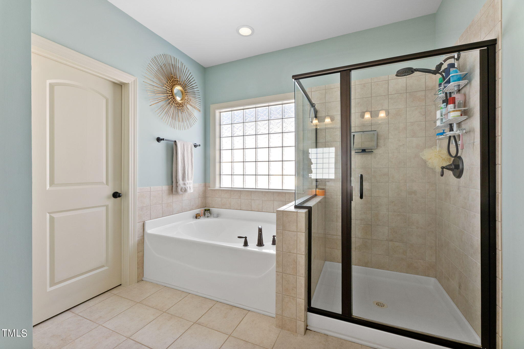 844 Historian Street Raleigh, NC 27603 - Photo 20 of 25 a bathroom with a bathtub and a shower