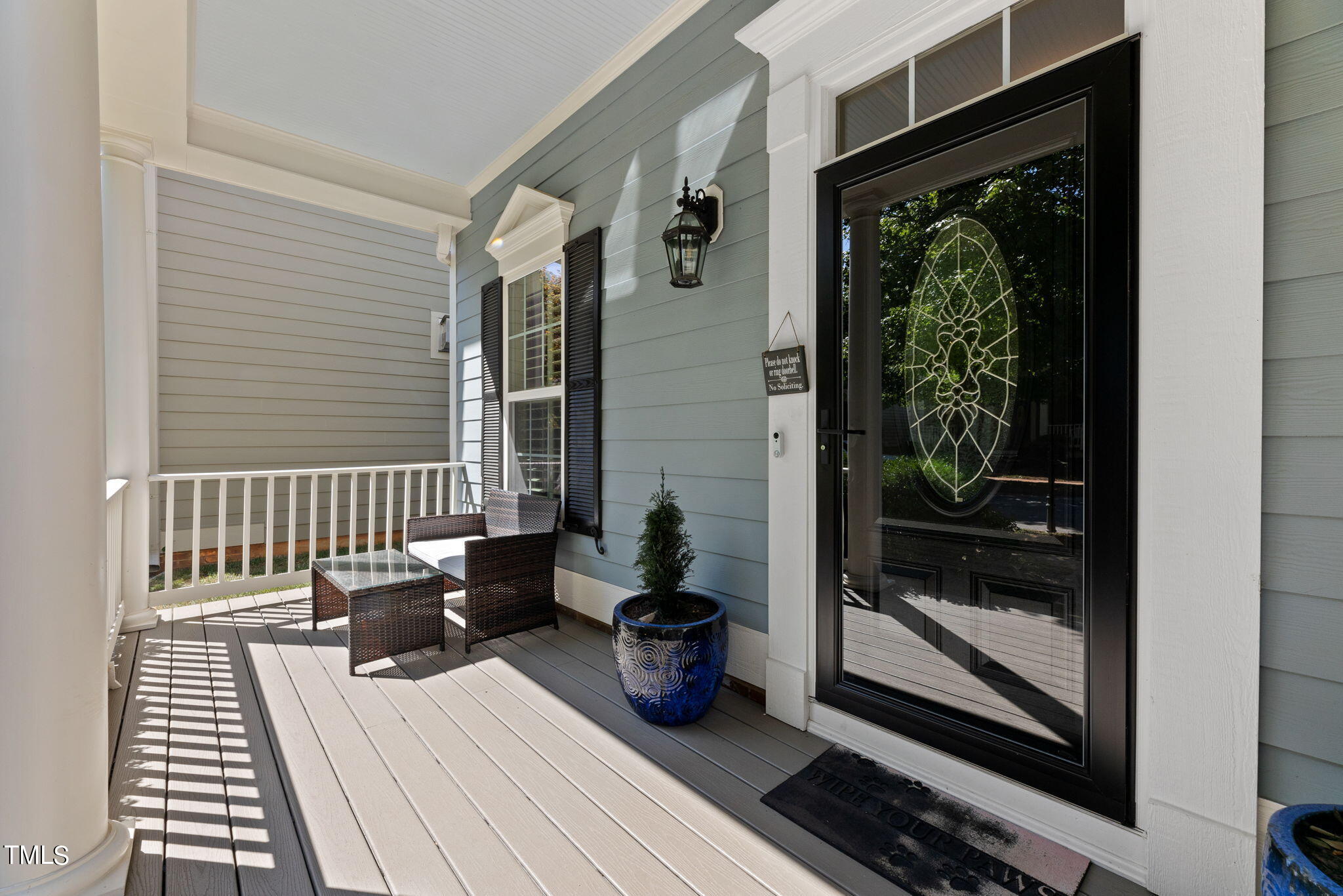 844 Historian Street Raleigh, NC 27603 - Photo 3 of 25 a view of a balcony with chairs and wooden floor