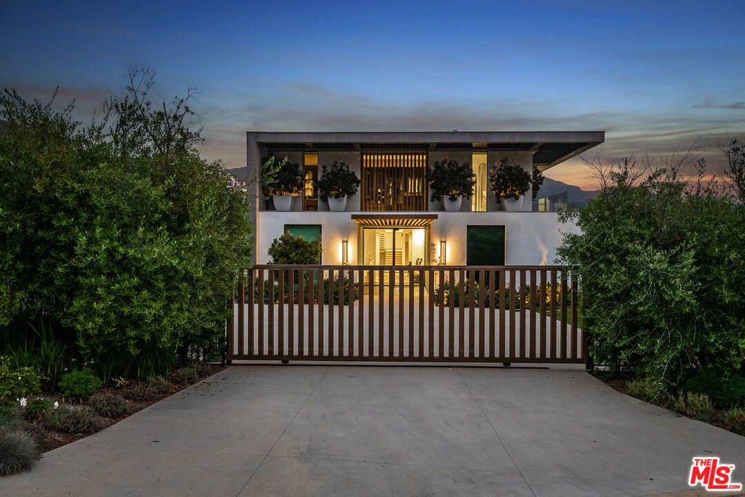 23919 Malibu Road Malibu, CA 90265 - Photo 15 of 33 a porch with swimming pool in front of house