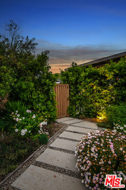 23919 Malibu Road Malibu, CA 90265 - Photo 16 of 33 view of a pathway both side of flower space