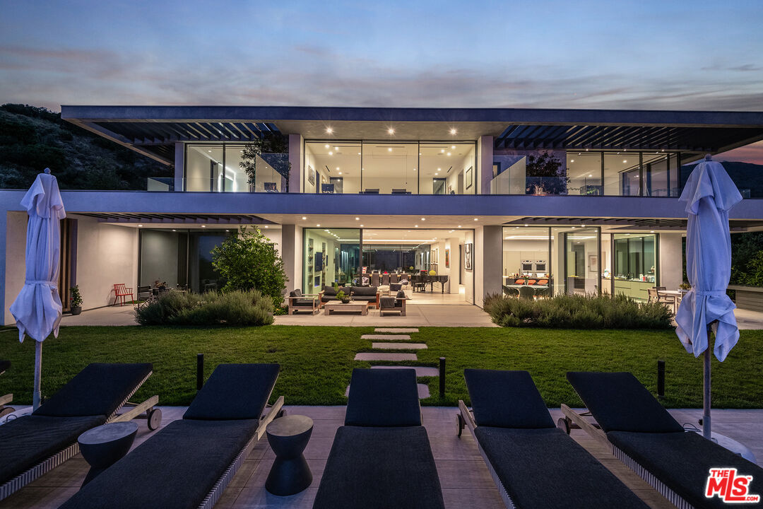 23919 Malibu Road Malibu, CA 90265 - Photo 18 of 33 a view of a brick building with a yard in front of it