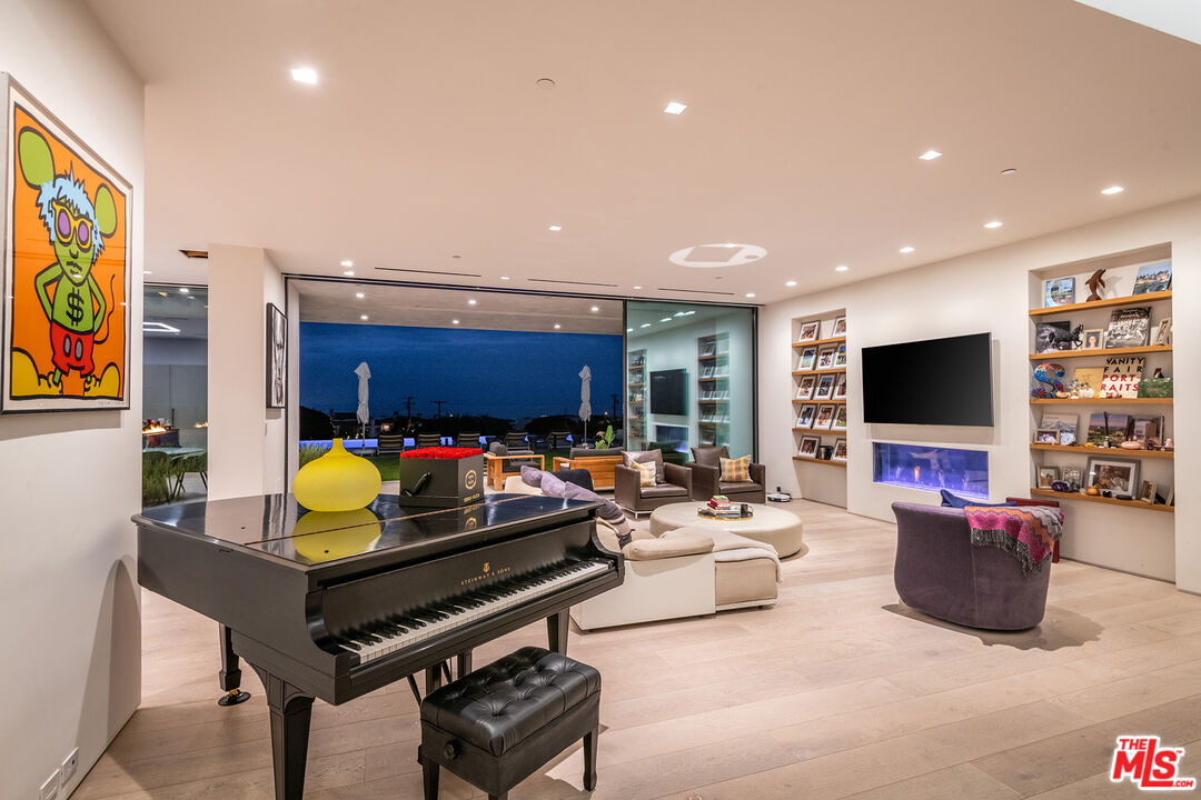 23919 Malibu Road Malibu, CA 90265 - Photo 23 of 33 a living room with furniture and a flat screen tv