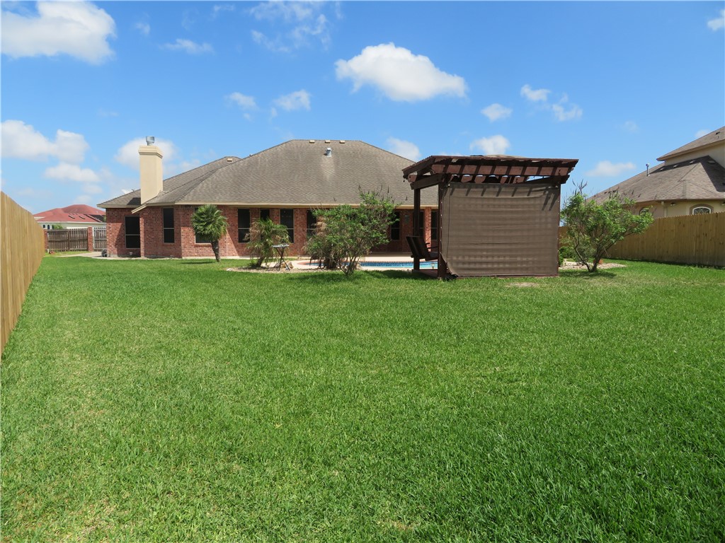 5803 South Oso Parkway Corpus Christi, TX 78414 - Photo 38 of 39 a view of a house with a yard and sitting area